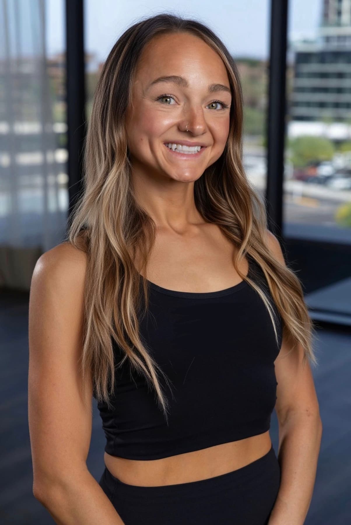 Steph Nuccio smiling in a sunlit training studio